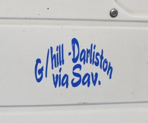 Bus and taxi decals indicate the route they are supposed to travel